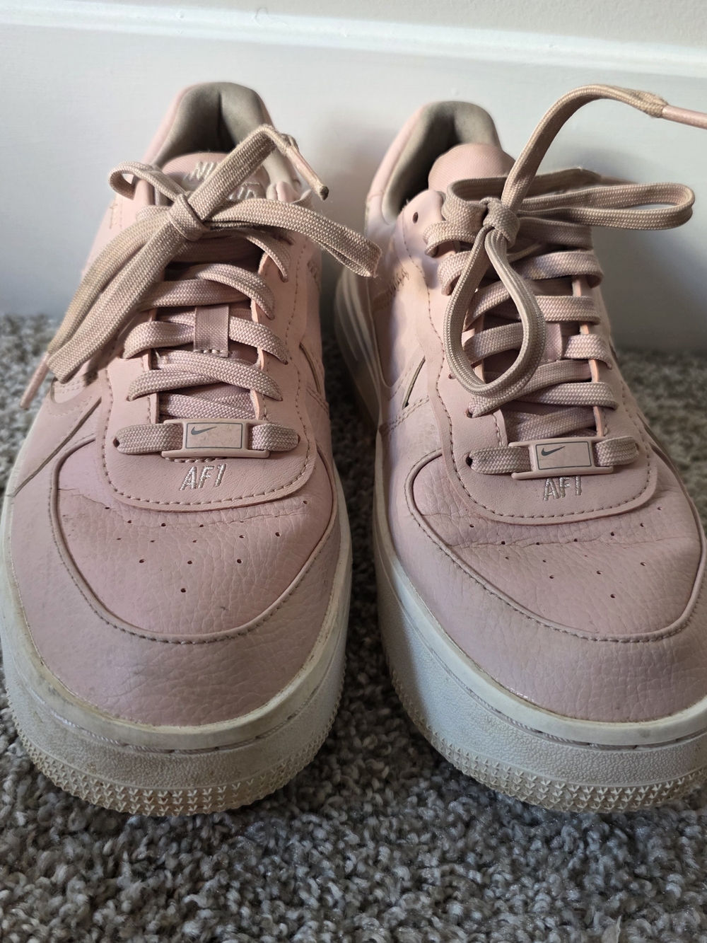 Nike Women’s AF1 Low Top Sneakers in Light Pink